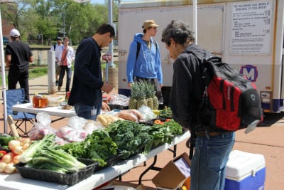 Farm to Family Naturally Mobile Market stand at the Delmar MetroLink Station