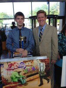 First Place High School Artist Michael Holdman and St Clair County State's Attorney Brendan Kelly