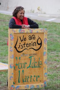 Artist Cyndi Redmond-Jenkins waits for her work to be installed.