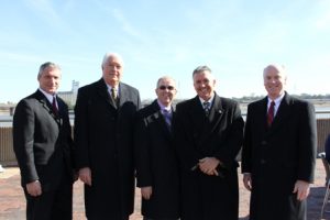 Nations and other project partners pose for a photo on the riverfront.