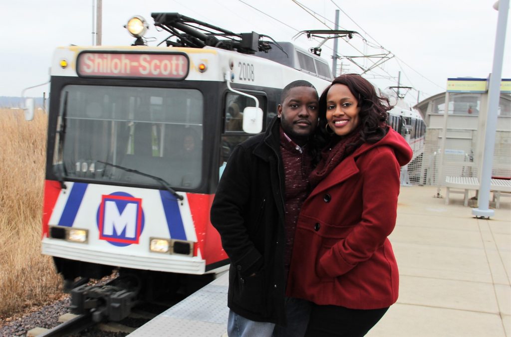 couple in front of MetroLink train