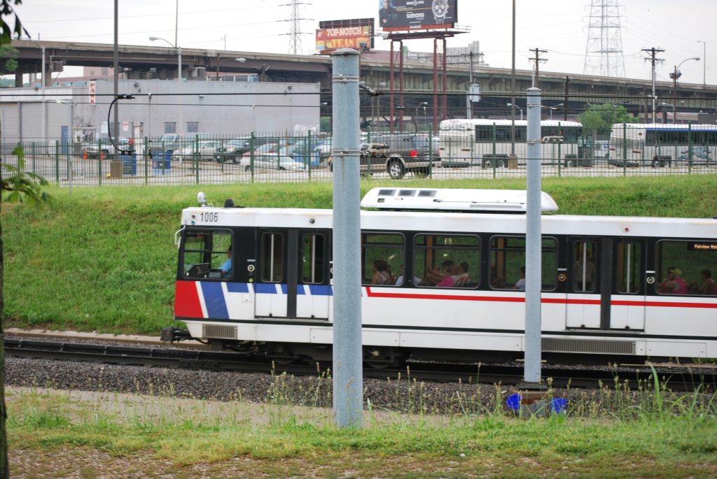 metro lines train near parking lot