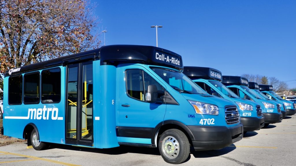 New Metro blue Call-A-Ride vans shown lined up side by side