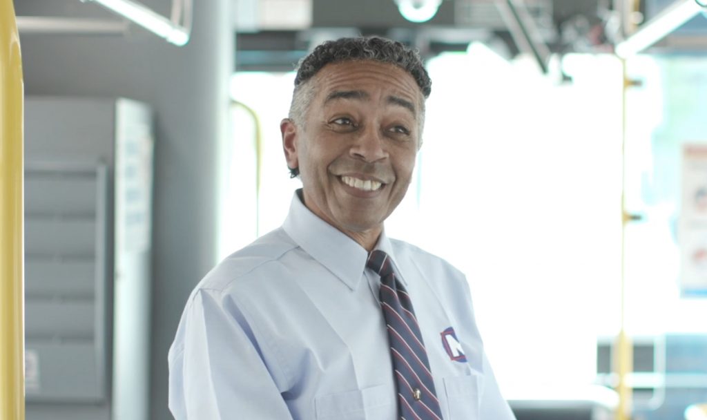 MetroBus Operator Bobby on a bus, smiling