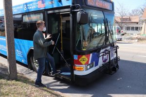 Everett boarding a MetroBus