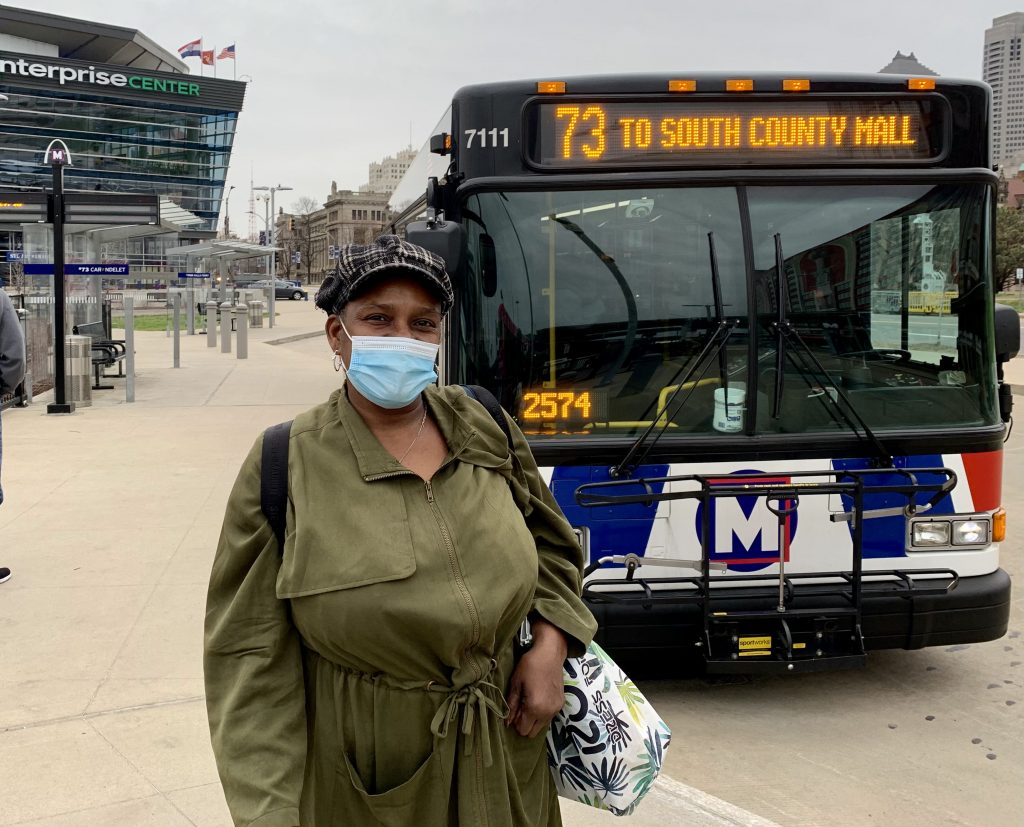 Image of passenger Vickie standing in front of a #73 bus at Civic Center Transit Center