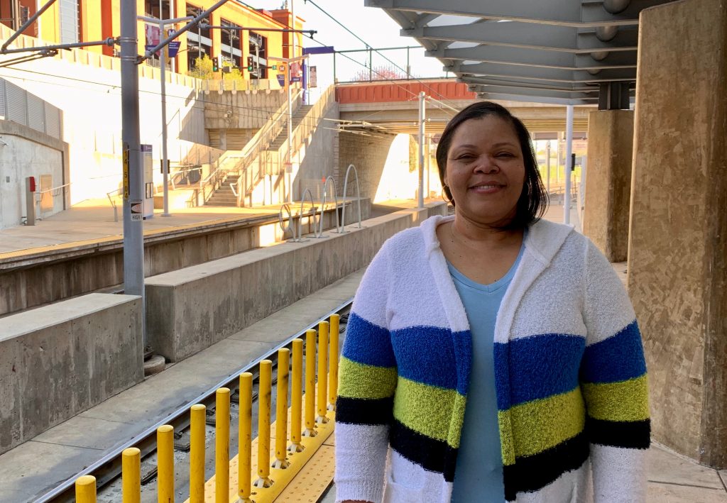 Passenger Nicole standing on the platform at the Stadium MetroLink Station