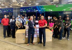 Taulby Roach (front-left) and James Clark (front-right) with team members from Metro Transit, Bi-State Development and Urban League of Metropolitan St. Louis