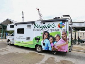 Image showing a Betty Jean Kerr People’s Health Centers Mobile Health Screening van at a Metro Transit Center