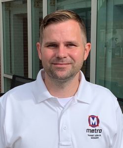 Headshot of TSM Jordan standing outside a Metro facility building