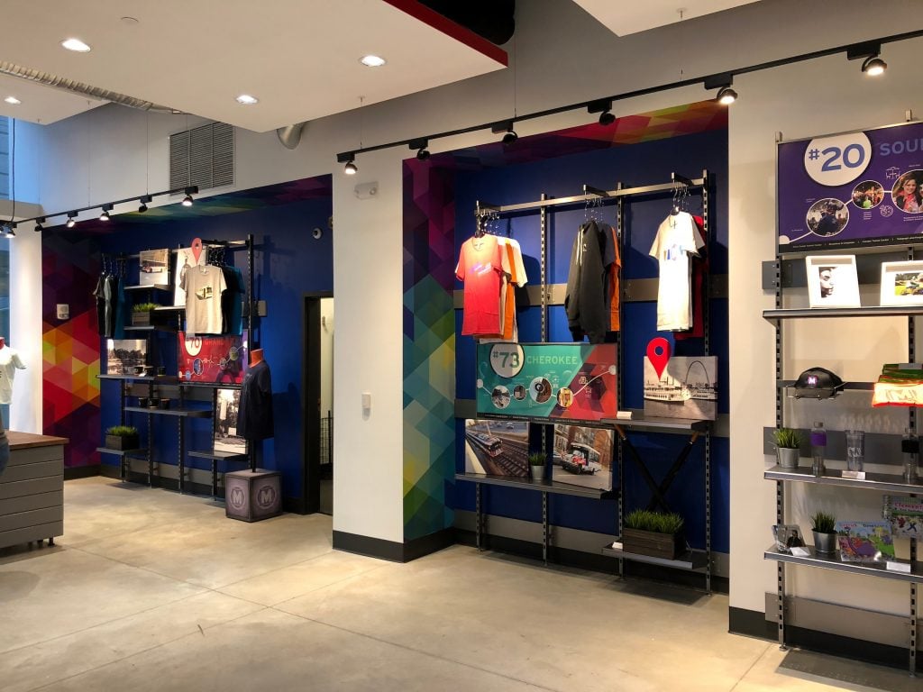Interior of the MetroStore in Downtown St. Louis. T-shirts and merchandise are displayed in alcoves along the wall.
