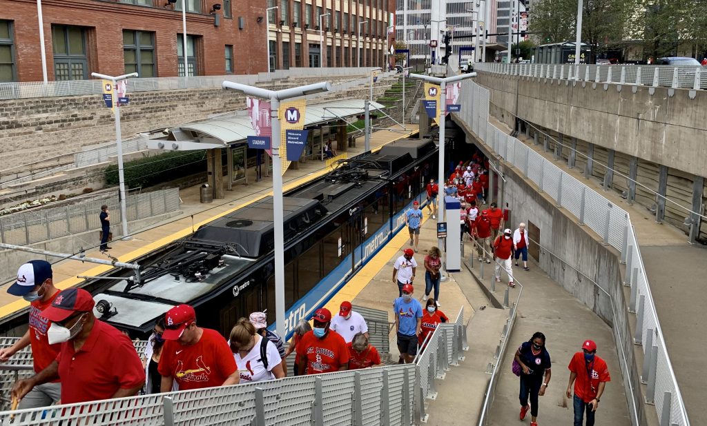 Imagine of St. Louis Cardinals fans walking up the stairs and on the platform as the make their way to Busch Stadium.
