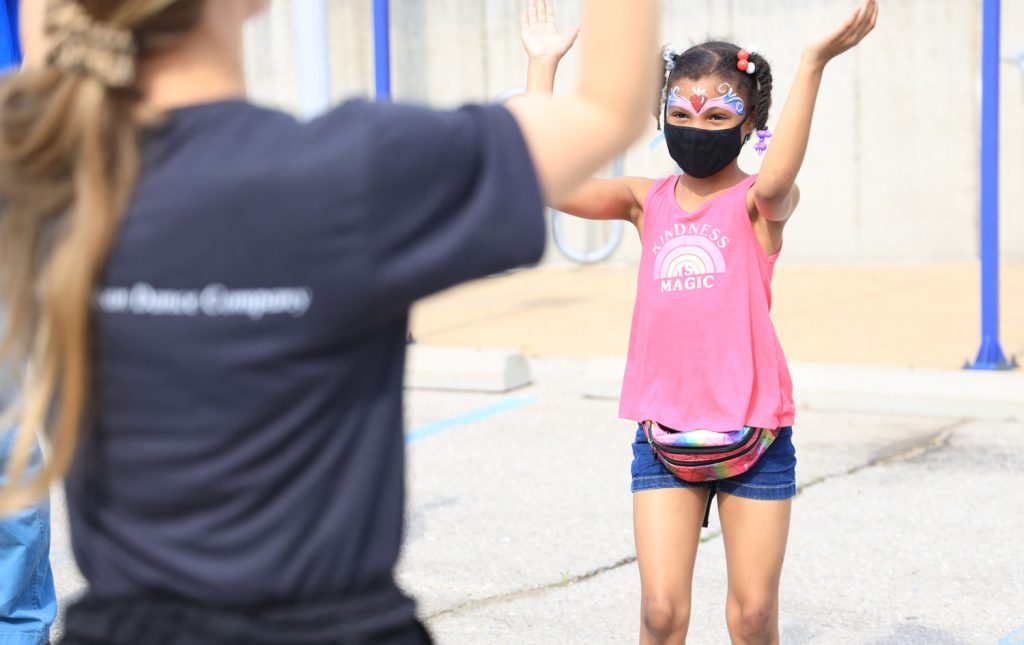 Child at MetroFest, participating in the dance class portion of the event