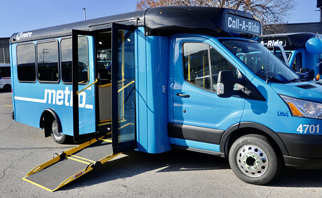 Call-A-Ride van with wheelchair ramp extended for boarding