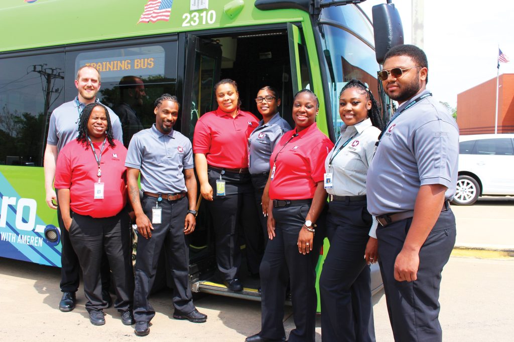 New MetroBus Operators Posing Outside of an Electric MetroBus