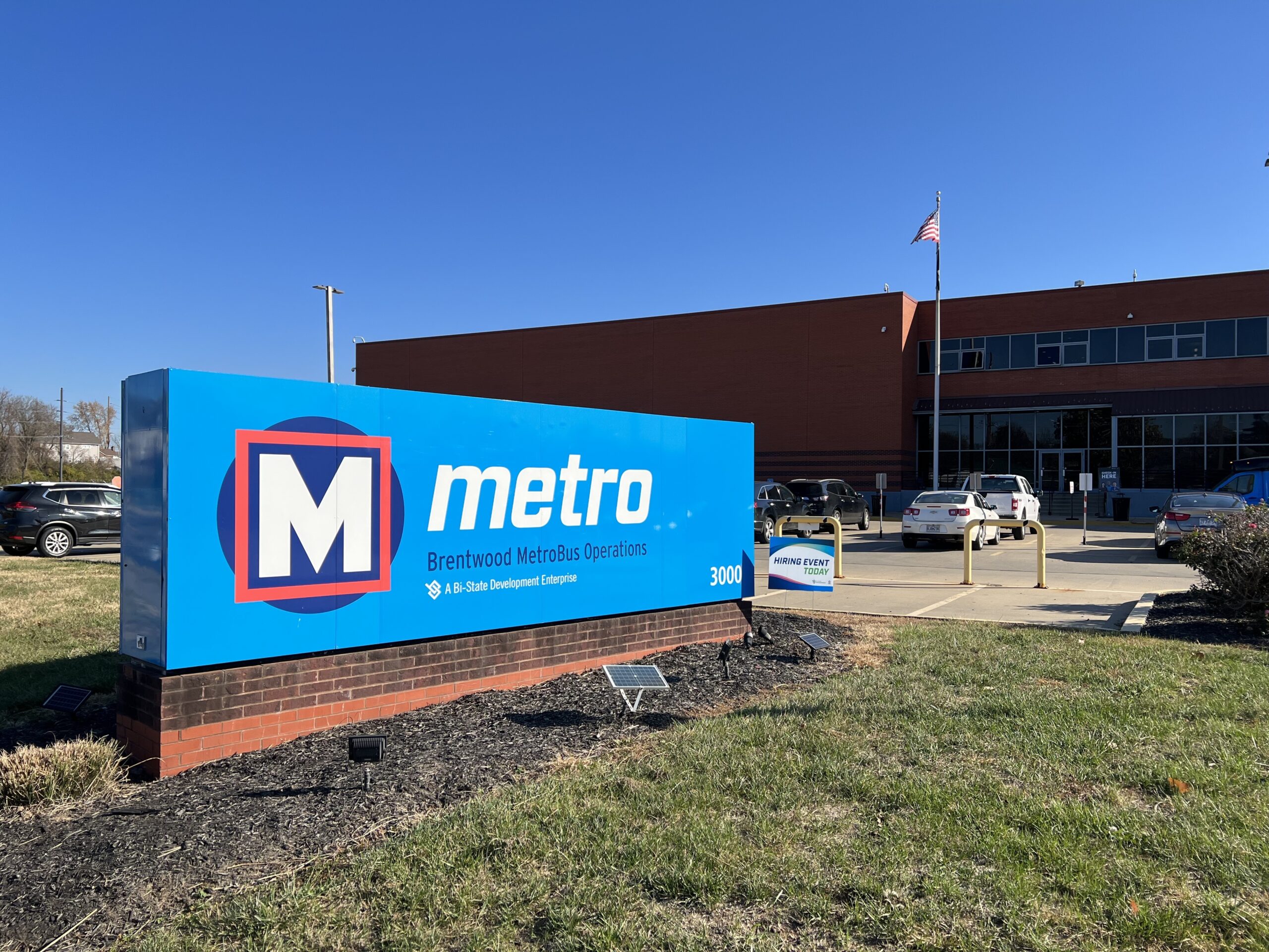 Brentwood MetroBus Facility sign with building in the background