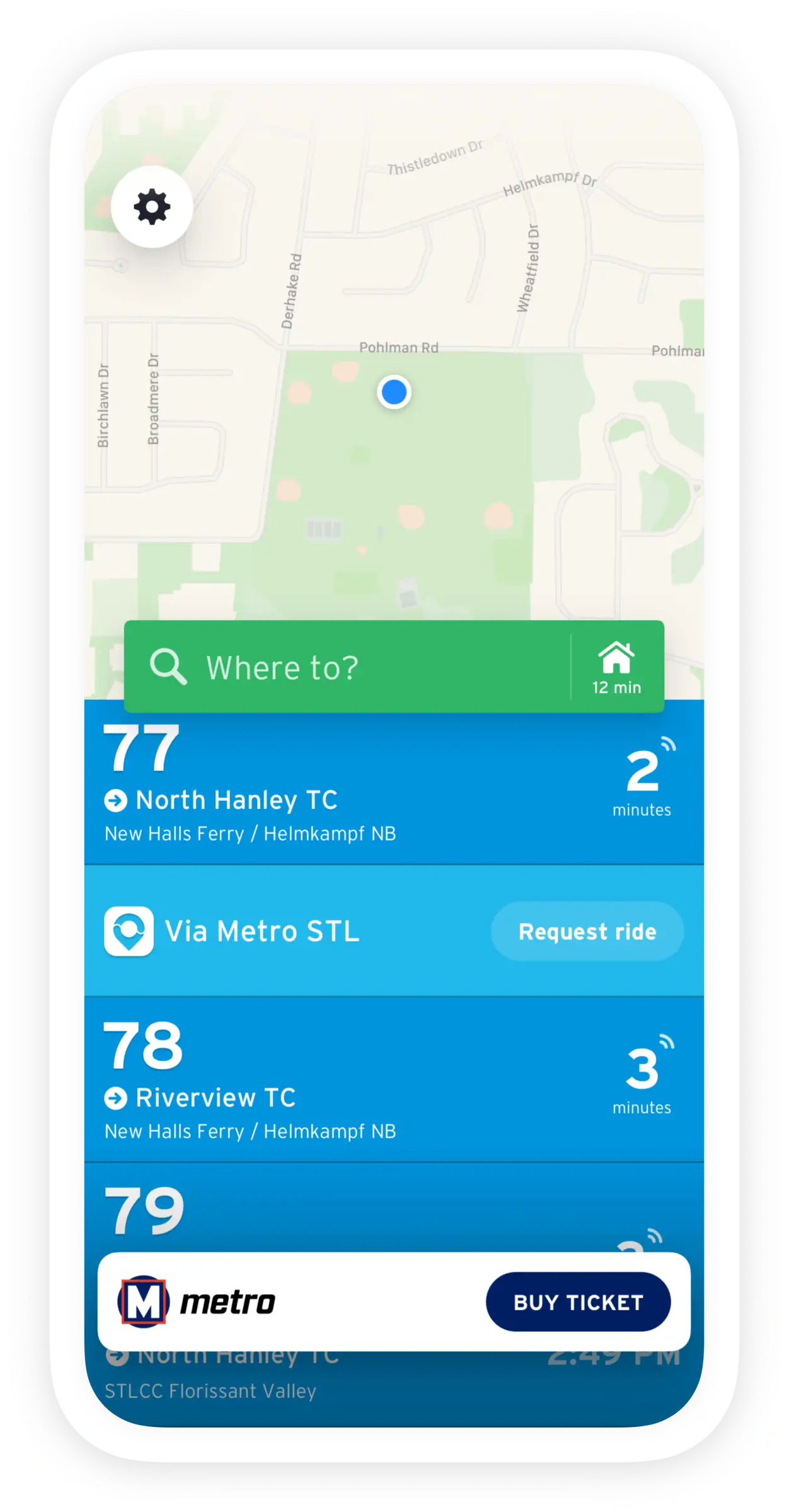 Phone screen showing Transit App with the user's GPS location as a blue dot on the map, an input box labeled 'Where To?' with example routes nearby the user including MetroBus routes 77, 78, and 79, and to request a ride with Via Metro STL